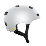 The POC Crane MIPS Helmet in Matte White features multiple ventilation holes, black adjustable straps, a dual-density liner for protection, and a yellow MIPS safety label on the lower back for rotational impact safety.