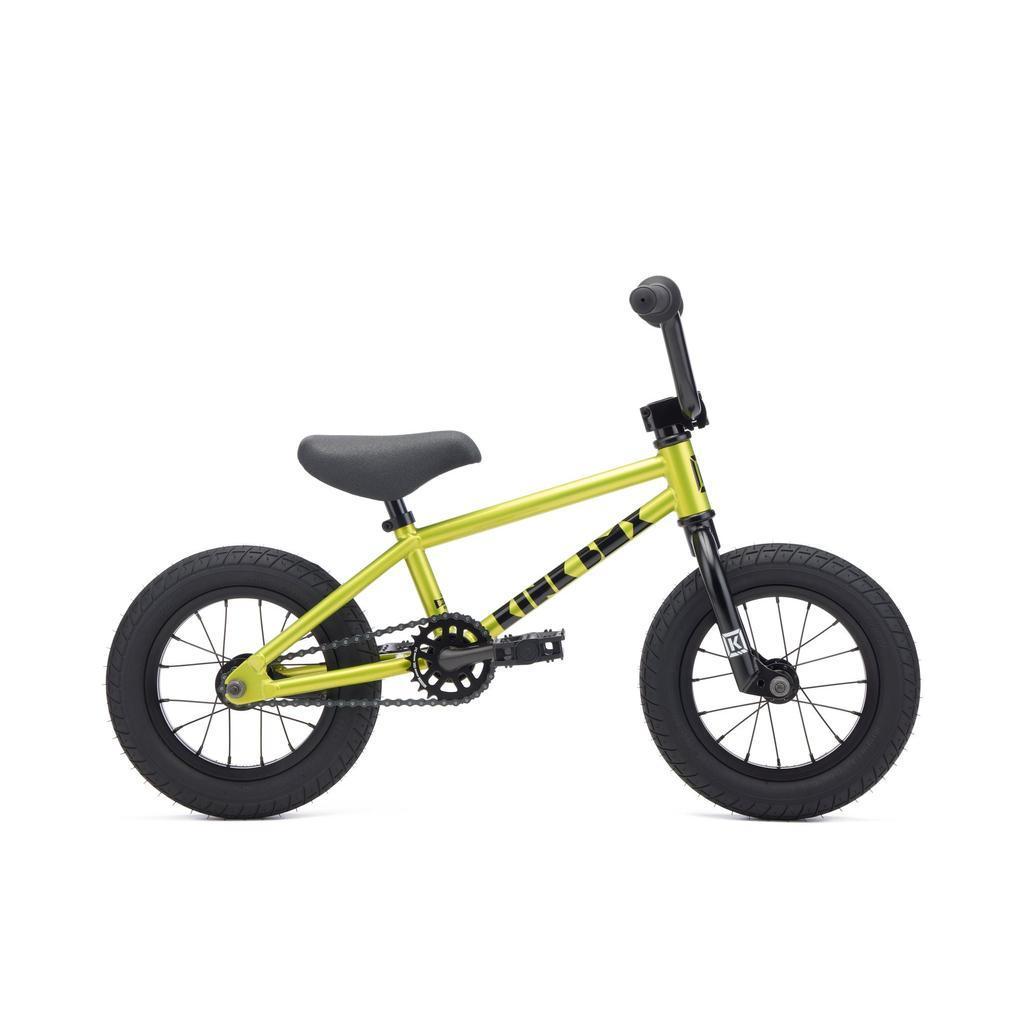 The Kink Roaster 12 Inch Bike (2027) is a small yellow kids’ bike with black handlebars, seat, and tires, lightweight and shown side-on against a white background—a perfect balance bike alternative.