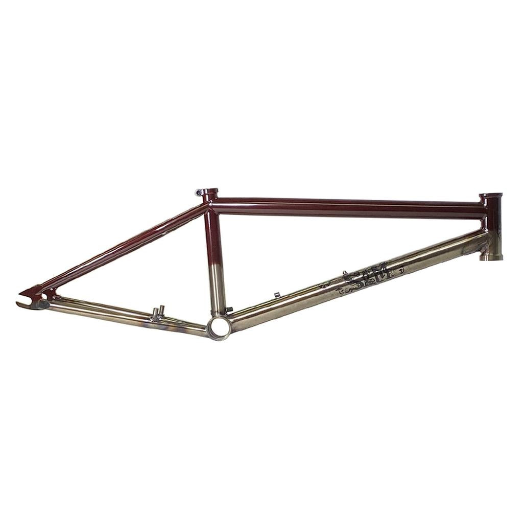 The S&M Black Magic Frame is a two-tone chromoly BMX frame with a brown top tube and metallic gold lower tubes, made from Thermal-X tubing, displayed on a white background.