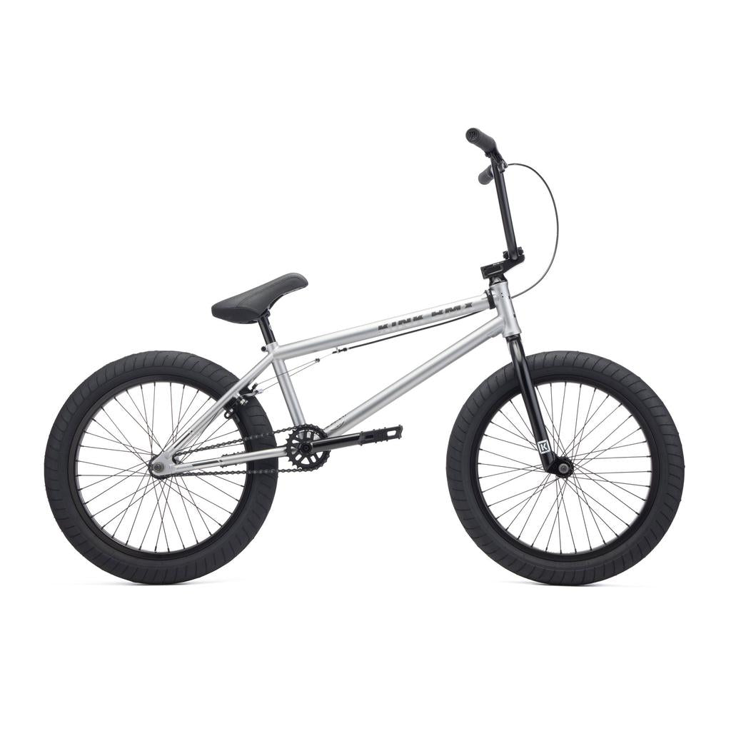 The Kink Whip 20 XL Inch Bike (2027) is a silver full Chromoly BMX with black tires, black seat, and straight handlebars—perfect for beginner riders—pictured in side profile on a white background.