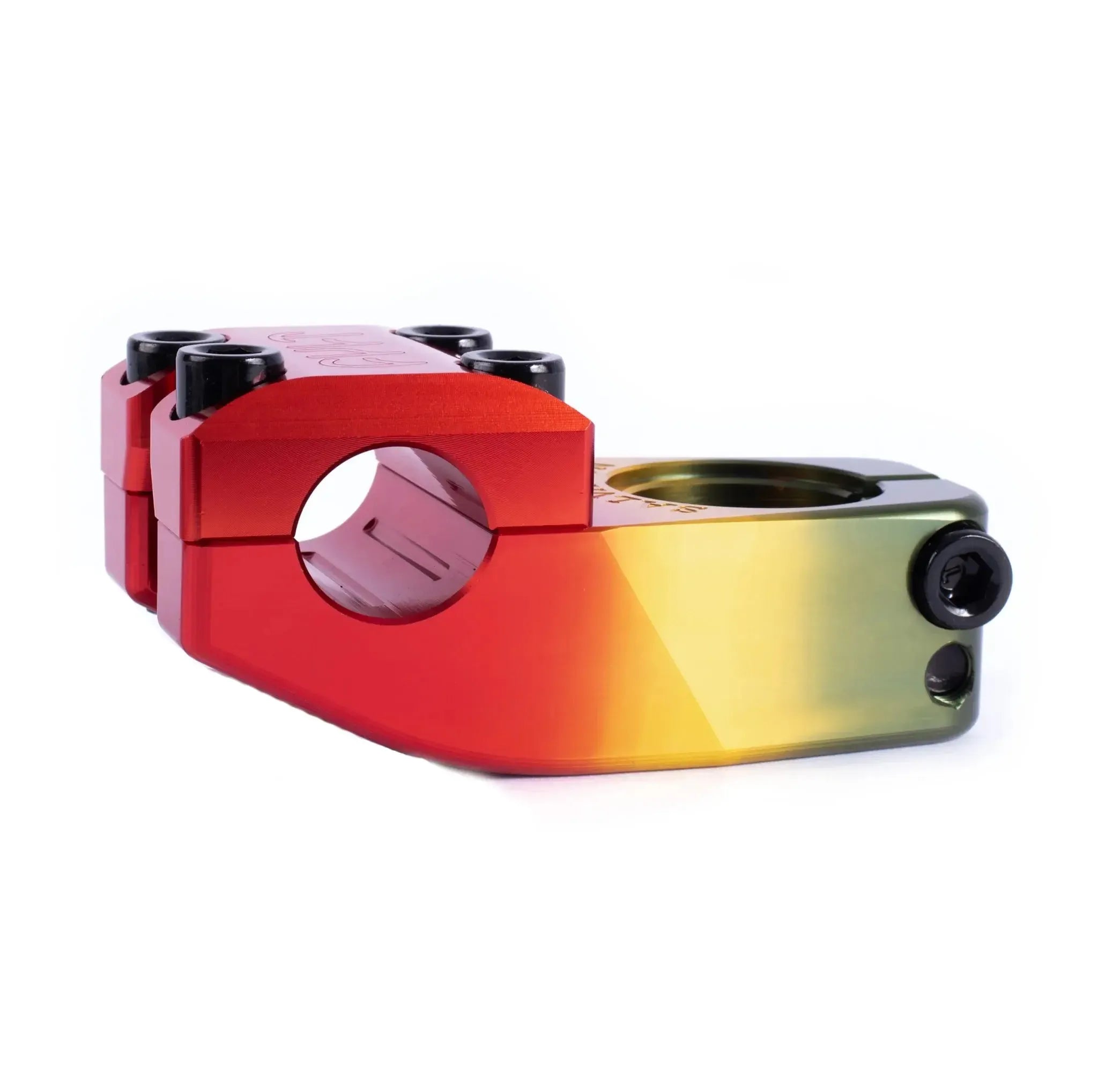 A close-up of the Cult Salvation V4 Stem, anodized in a red, yellow, and green gradient with visible bolts and a cylindrical clamp design, offering a 32mm rise for ideal handlebar positioning.