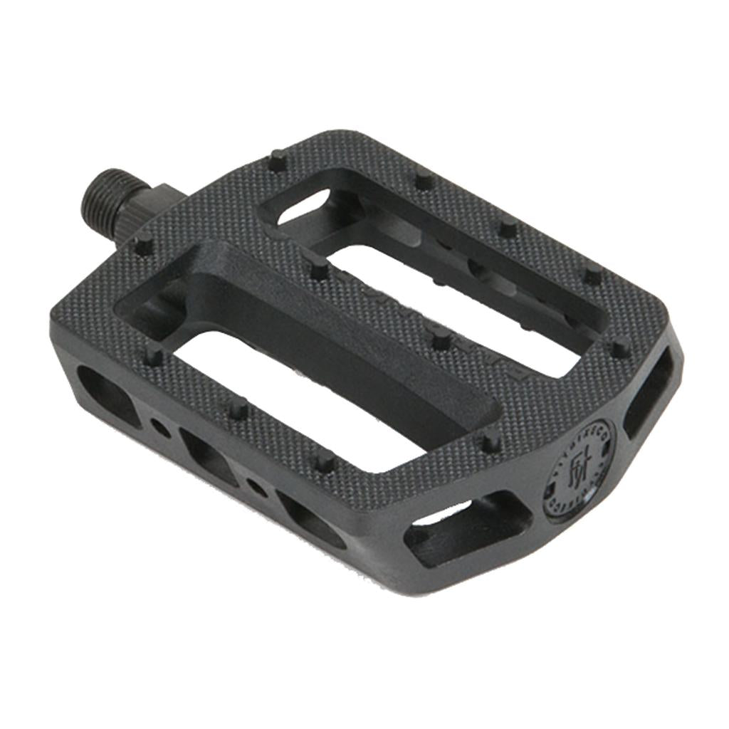 The Fit Mac Plastic Pedals feature a black flat design with a textured grip surface, concave shape, metal spindle, and multiple cutouts for reduced weight.