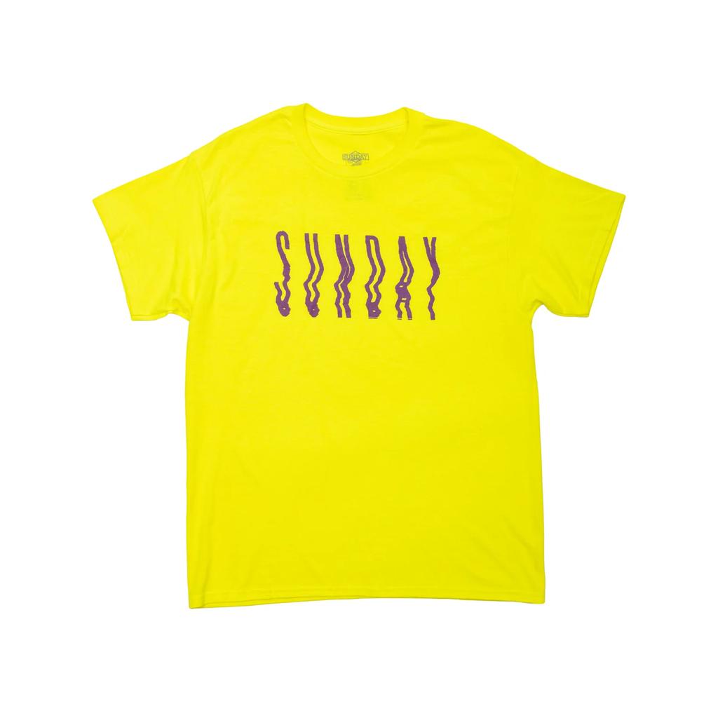 The Sunday High Wave T-Shirt features bright yellow fabric with "SUNDAY" in wavy purple print across the chest—great for adding bold style to your look.