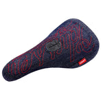 The Odyssey Big Stitch Pivotal Seat features a denim-textured cover, bold red embroidered lettering, a black logo patch in the center, and a red "ODSY" side tag, combining classic style with durable black canvas construction.