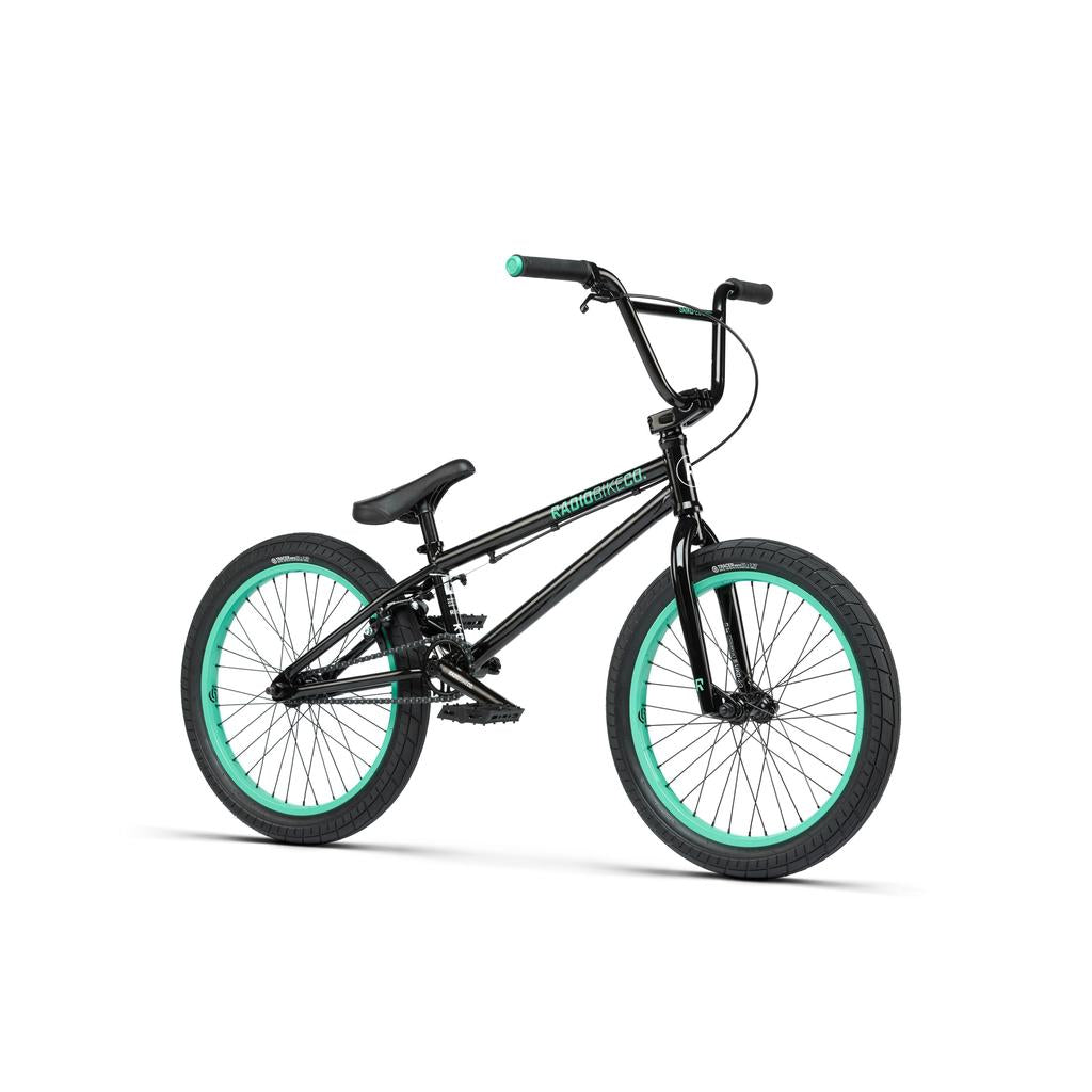 A Radio Saiko 20 Inch Bike in black with turquoise wheel and grip accents and Salt Tracer Tyres is displayed on a white background.