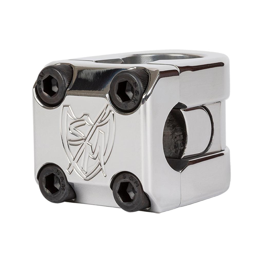 The S&M Redneck FLT Flatland Stem is a polished metal BMX stem featuring four hex bolts and an engraved shield logo on the front face.