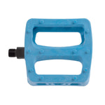 A blue Odyssey Twisted PC Pro Pedal, crafted from durable nylon composite with a rectangular design and two large cutouts, is shown from above—ideal for BMX riders who want both style and performance.
