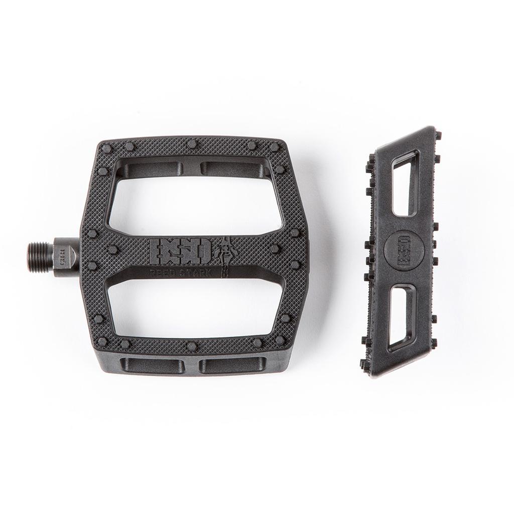 The BSD Safari PC Pedals, shown in black with a textured surface and removable grip plate, are made from durable nylon fibreglass and displayed on a white background.