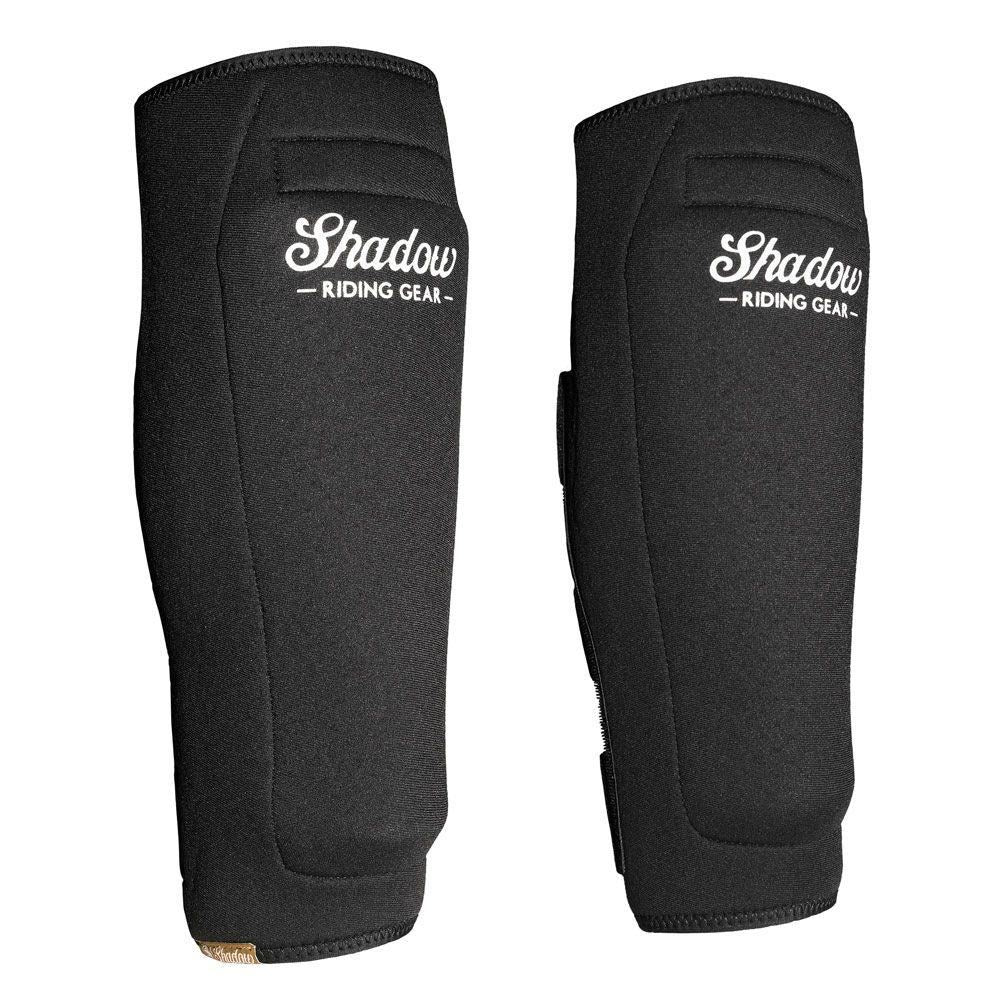 Pair of black Shadow Shinners Shin Pads (Pair) shown from front and side angles on a white background, ideal for riders seeking extra leg protection alongside their usual gear.