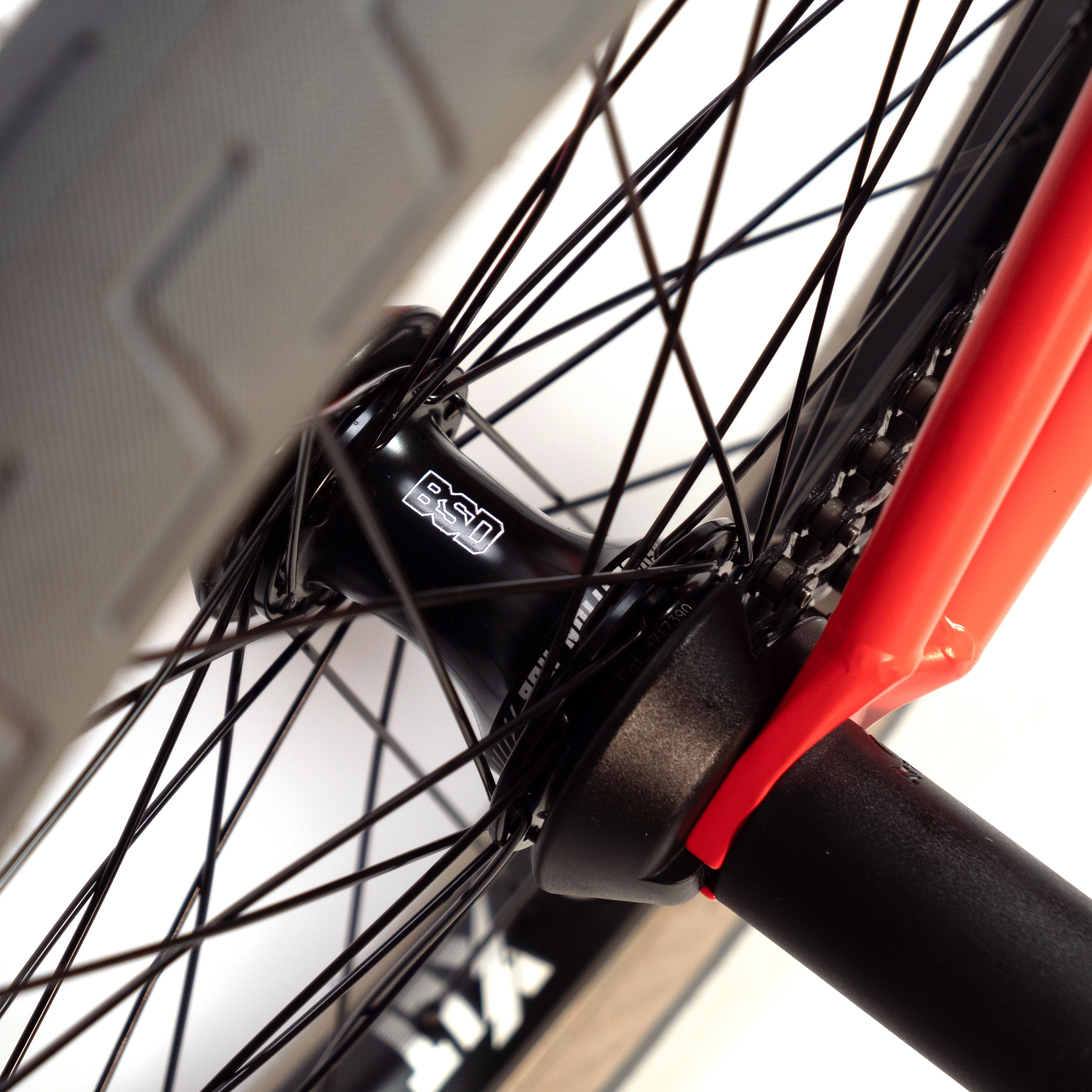 A close up of a BSD ALVX AF+ Custom 20 Inch Bike with black spokes and aftermarket parts.