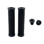 Two black DRS Mushroom Grips with a subtle mushroom design stand upright side by side, each paired with a matching press-fit bar end, all displayed on a clean white background.