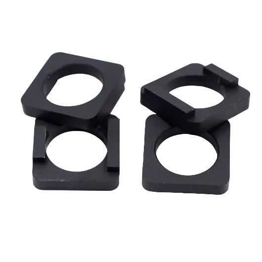 Four black, square plastic washers with circular center holes and notches on one side—Speedco M2 Dropout Adapters—are arranged in pairs on a white background.