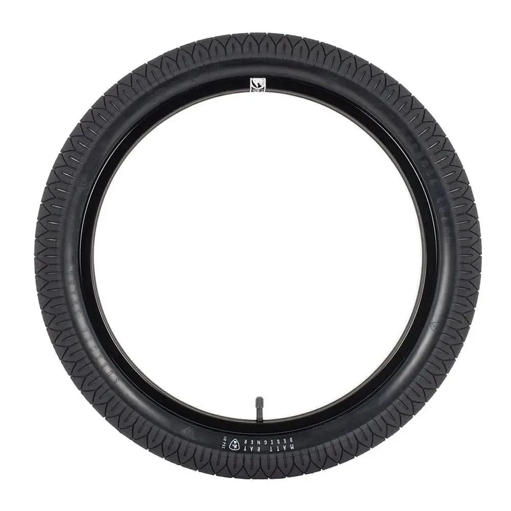 The Subrosa Designer Tyre in black features a visible valve stem and is ideal for BMX street riding—trusted by top riders.
