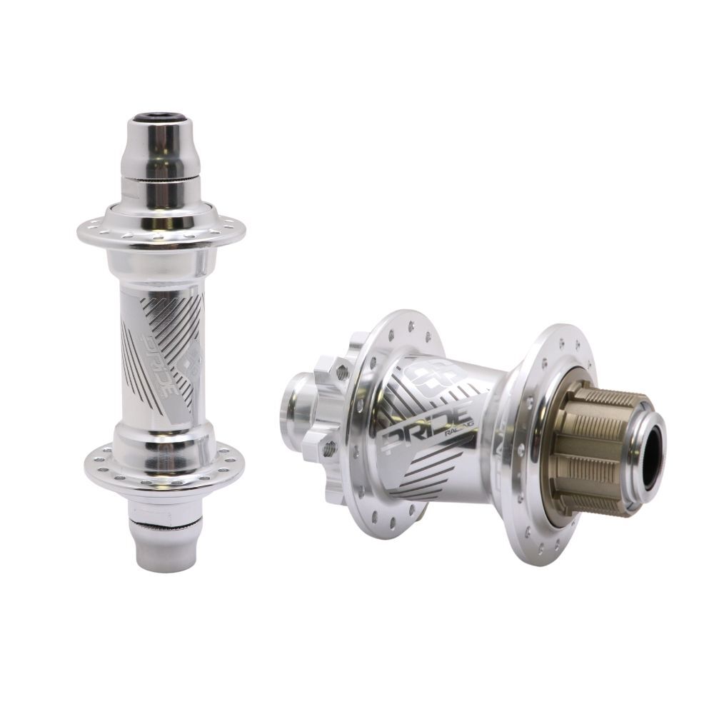 Two metallic Pride Control Expert V2 28H hubs, one front and one rear, are displayed side by side on a white background. The rear hub features a robust 15mm thru-axle design with ISO6 disc mount compatibility for versatile braking options.