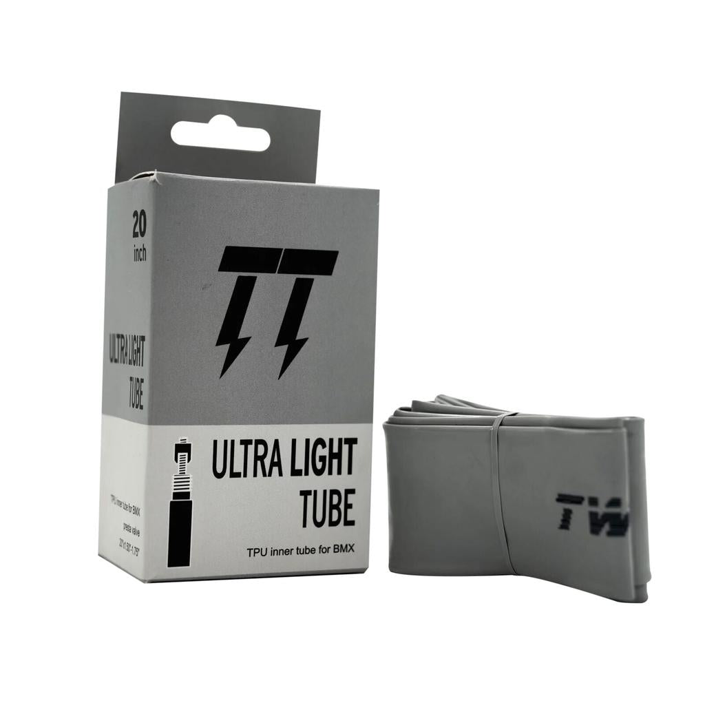 A folded TPU inner tube sits beside its "Twitch Lightweight Tube" box labeled for 20 x 1-1/8–1-3/8 inch BMX wheels. This super light tube cuts rotational weight, helping riders accelerate faster.