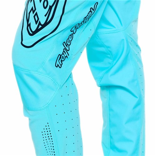 Close-up of TLD 26.1 Sprint Pro Pants in Mono Real Teal, featuring the "Troy Lee Designs" logo and black graphics on the upper thigh and knee. Made from durable 4-way stretch fabric for maximum comfort on every ride.