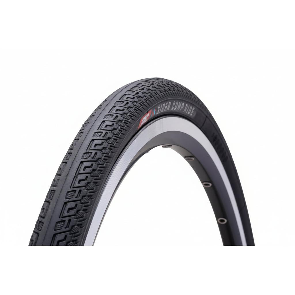 A close-up view of the IRC Siren Comp Rise Cruiser 24 Inch Tyre in black, featuring a textured tread pattern and a partially visible silver wheel rim set against a white background, showcasing the premium details of this foldable bicycle tyre.