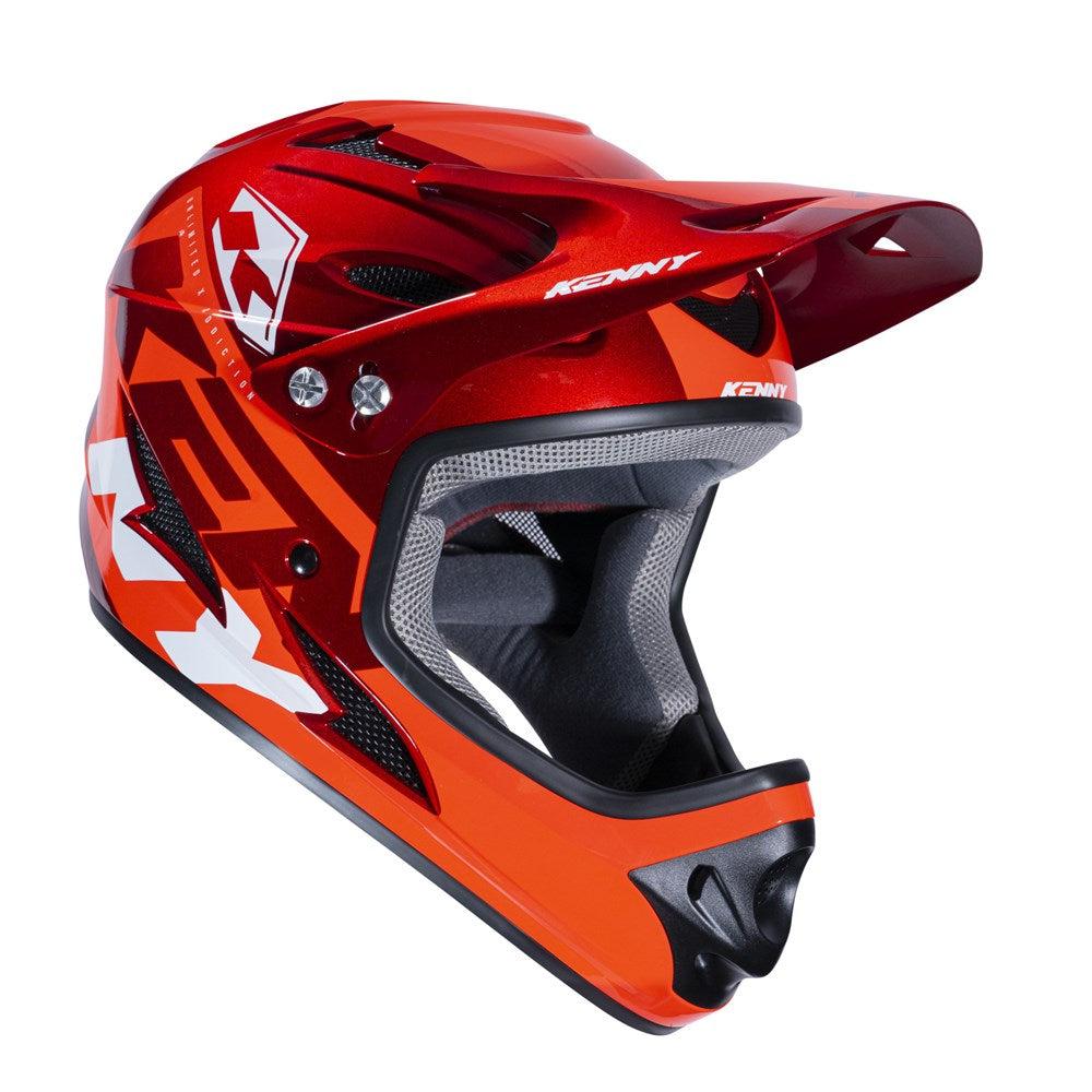 Kenny Racing Helmet Red: A red and white full-face motocross helmet featuring a visor and a branded logo on the side.
