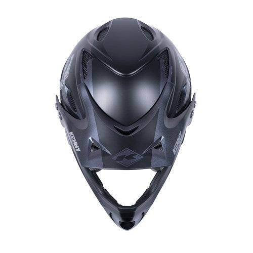 The Kenny Racing Downhill Helmet / Prisme, an Australian Certified sports helmet in black, boasts a sleek aerodynamic design with ventilation openings. Made from durable injected plastic, it is ideal for BMX enthusiasts and safety-conscious athletes.