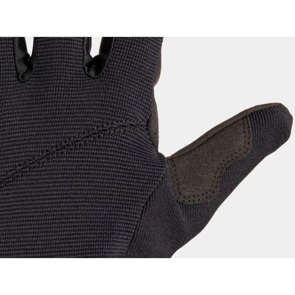 Close-up of a Fuse Alpha Youth Glove, showcasing intricate stitching and textured synthetic leather on the reinforced thumb area.