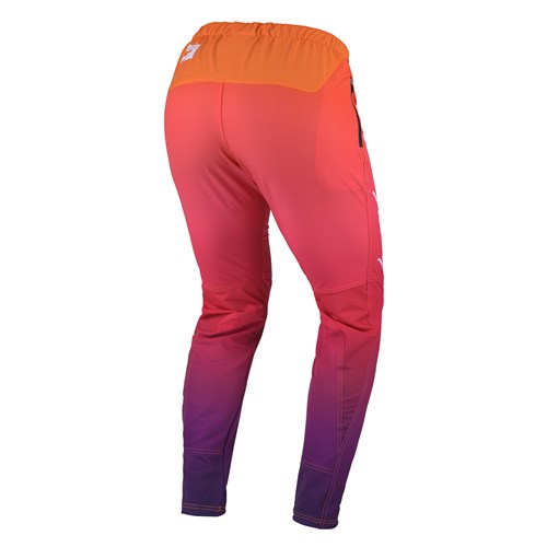 The Kenny Racing Prolite Paint Maker pants are ultra-light, stretch athletic wear with a gradient design that transitions from vibrant orange at the waistband to pink and violet at the ankles, shown from the back.