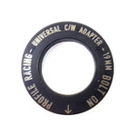 A black circular adapter ring with the text "PROFILE RACING - UNIVERSAL C/W ADAPTER - 19MM BOLT ON" inscribed around the edge, compatible with Profile Sabre Sprocket Insert.