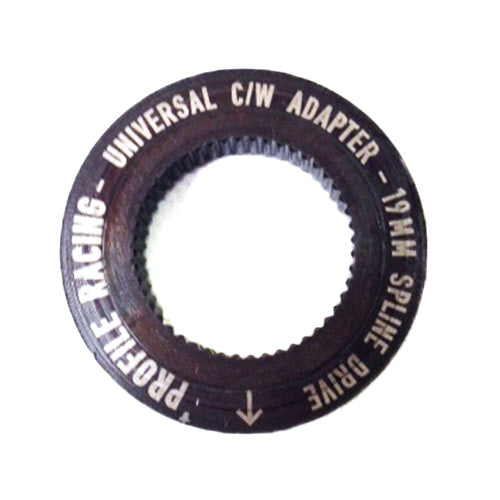 A circular adapter with text that reads: "Profile Sabre Sprocket Insert 19MM SPLINE DRIVE." The dark-colored adapter, featuring a toothed inner ring, is compatible with various crank sizes.