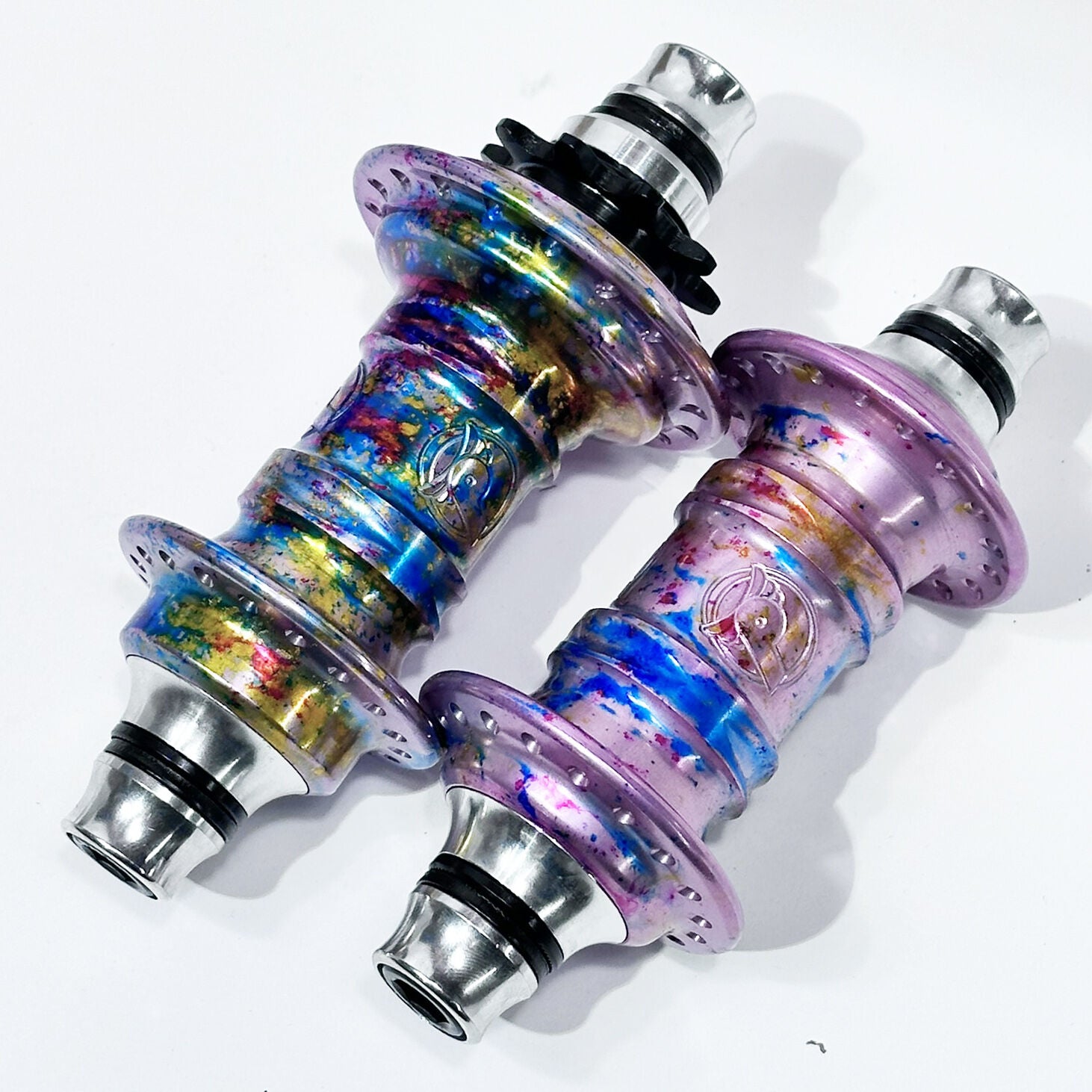 Two Profile Mini Front & Rear Hub Sets (LE-Galaxy Rust) with metallic blue, yellow, and purple finishes are placed side by side on a white background.