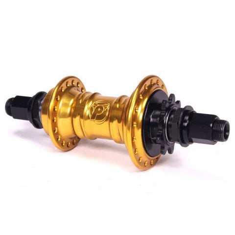 The Profile Mini Rear Cassette Hub boasts a low-flange design with a golden finish, complete with a black threaded axle and spoke holes, making it perfect for wheel assembly.