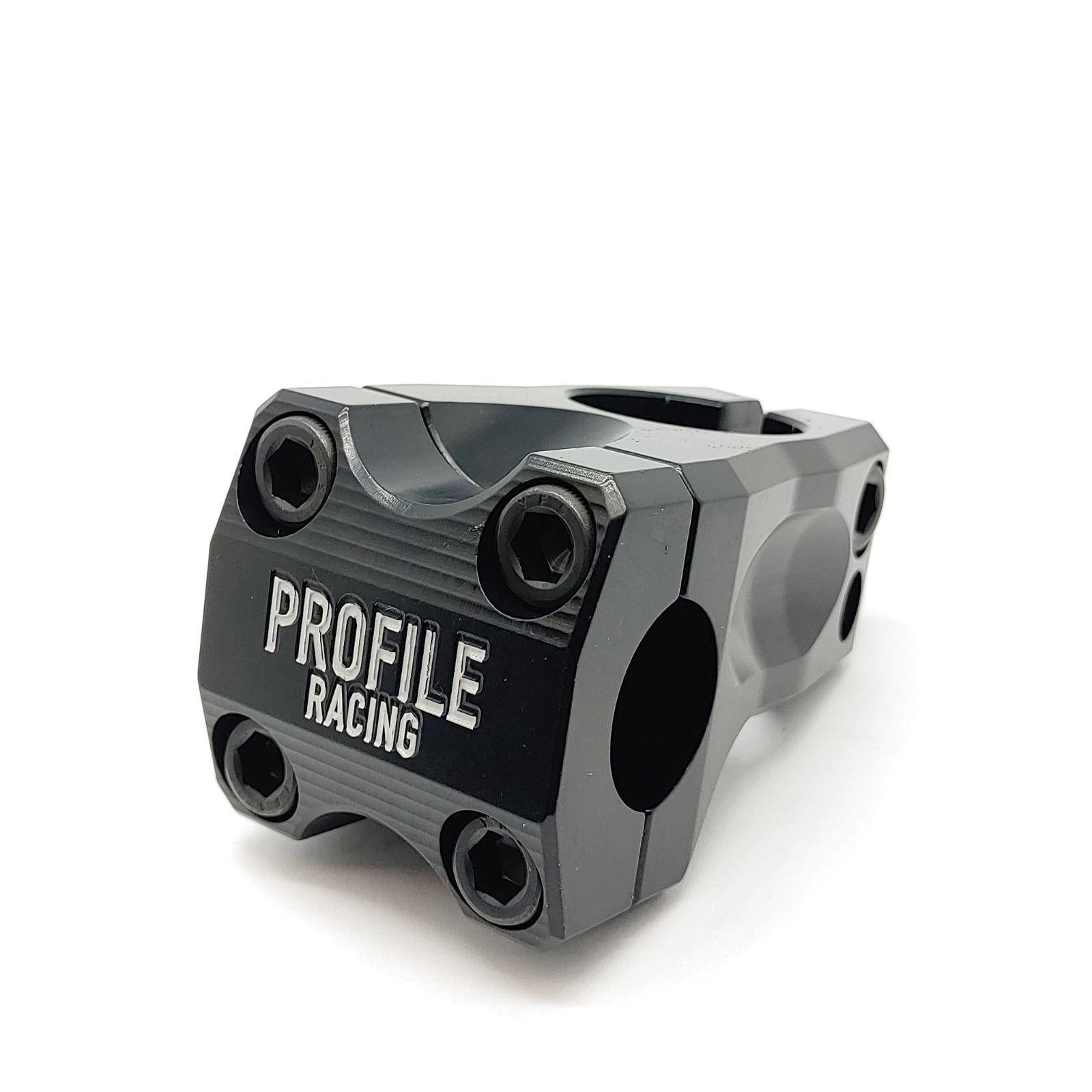 A close-up of the Profile Acoustic Stem, a black metal front load stem featuring four hex bolts and engraved branding on the front plate.