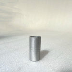 A 46mm Profile Tube Spacer stands vertically on a plain white surface, its cylindrical metal form reminiscent of the precision found in profile cranks.