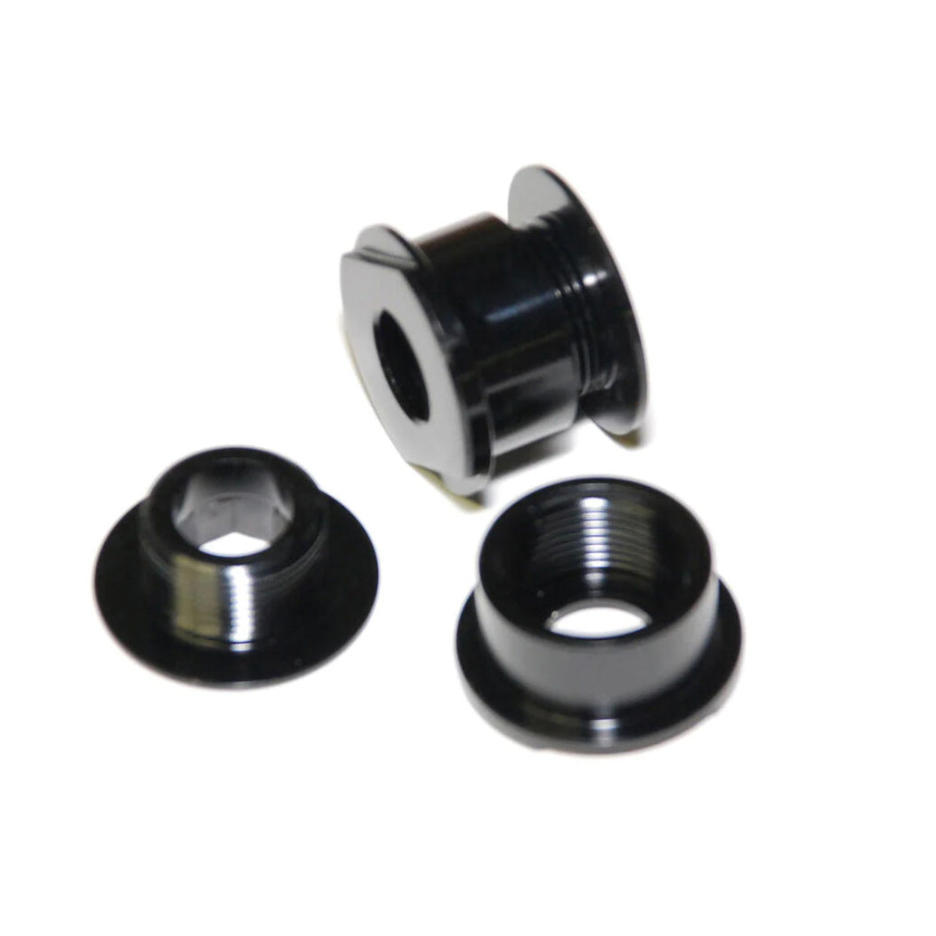 Three black metal bike chainring bolts are displayed on a white background, with two flat and one upright to reveal the threads—perfect for use with the Speedline 20-10mm Fork Adapter.