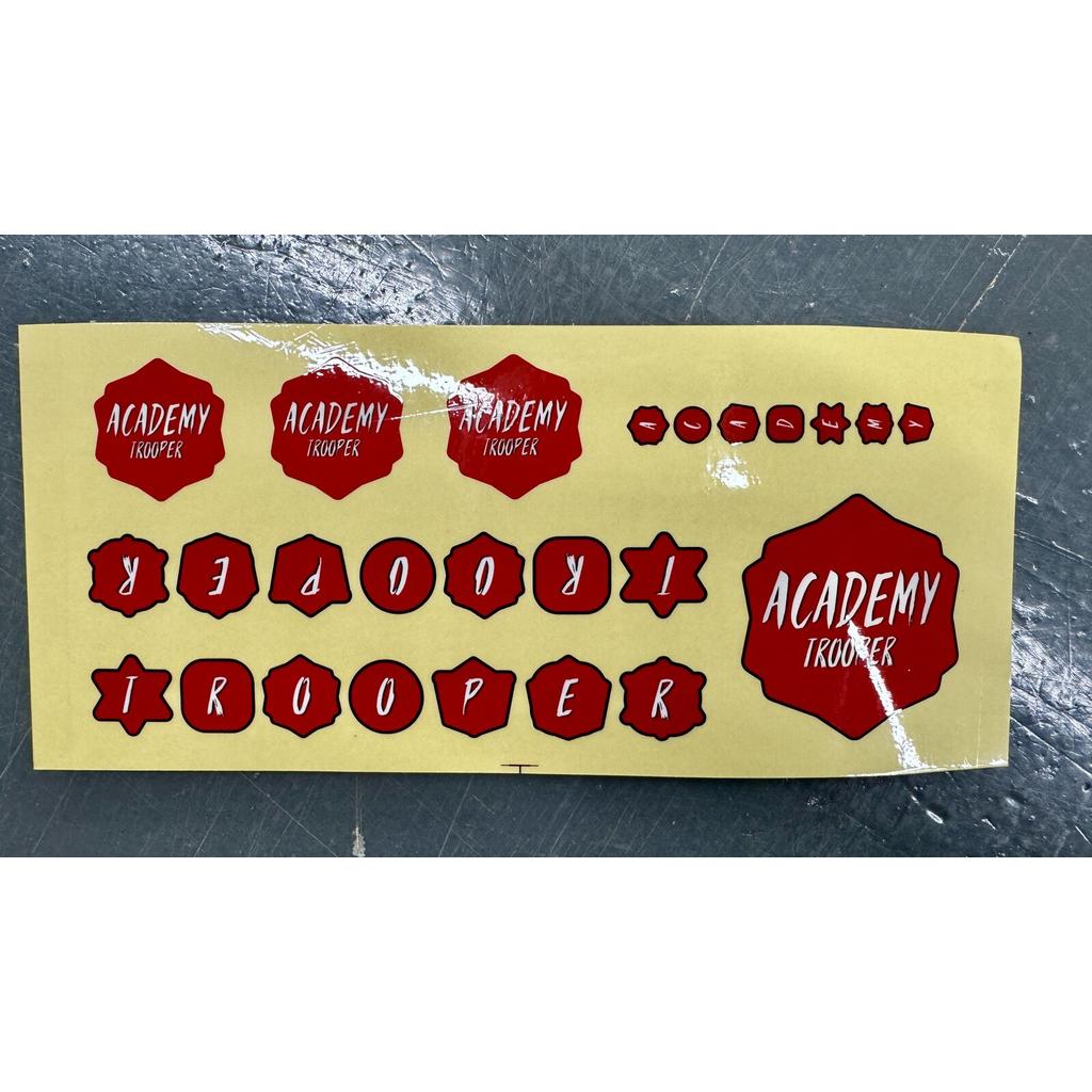 Academy Trooper Sticker Pack featuring red, scalloped-edge shapes containing the text “Academy Trooper” in various sizes and individual letters.