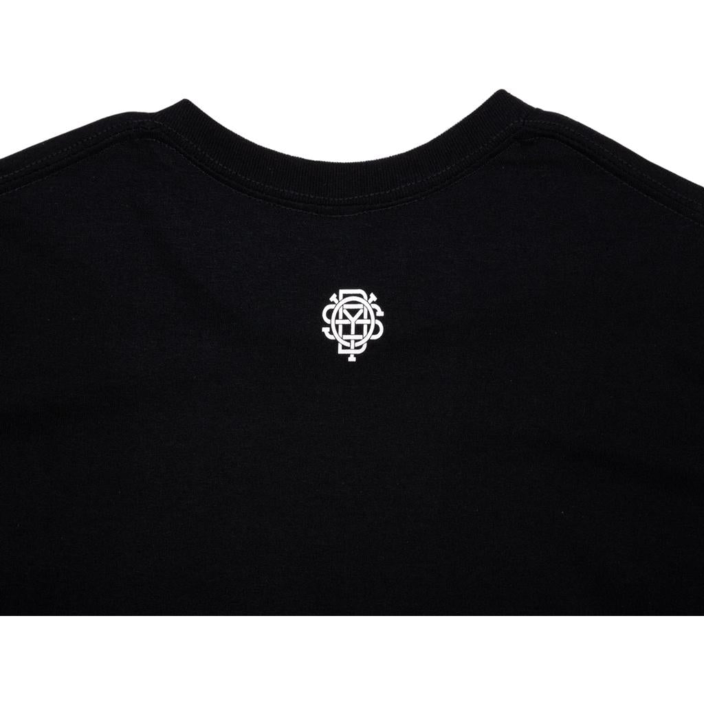 The Odyssey 40 Year T-Shirt features a small, detailed white geometric logo on the upper back near the neckline—a subtle design that elevates your style.