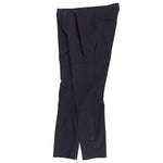 A pair of TLD 25.2 Ruckus Long Travel Pants in Mono Carbon, featuring front pockets and a button-drawstring waistband, made from 4-way stretch fabric, displayed on a white background.