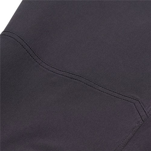 Close-up of the TLD 25.2 Ruckus Long Travel Pants / Mono Carbon in black, highlighting a seam and stitching detail on the 4-way stretch fabric.