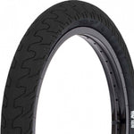 Close-up of the Rant Squad 18 Inch Tyre featuring a zigzag tread pattern for all-terrain riding, shown mounted on a metal rim.