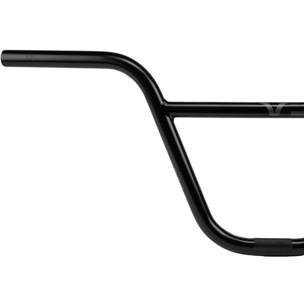 Matte black Wethepeople ARC (Murray Loubser) Bars with a 25.4mm OS clamp, constructed from 4130 chromoly, are shown against a white background. This BMX street handlebar features a crossbar and is viewed from the side, with one grip end partially out of frame.