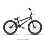 The Radio Saiko 20 Inch Bike, a black kids BMX with a compact frame, single gear, Chromoly three-piece cranks, and thick tires, is shown in side view against a white background.