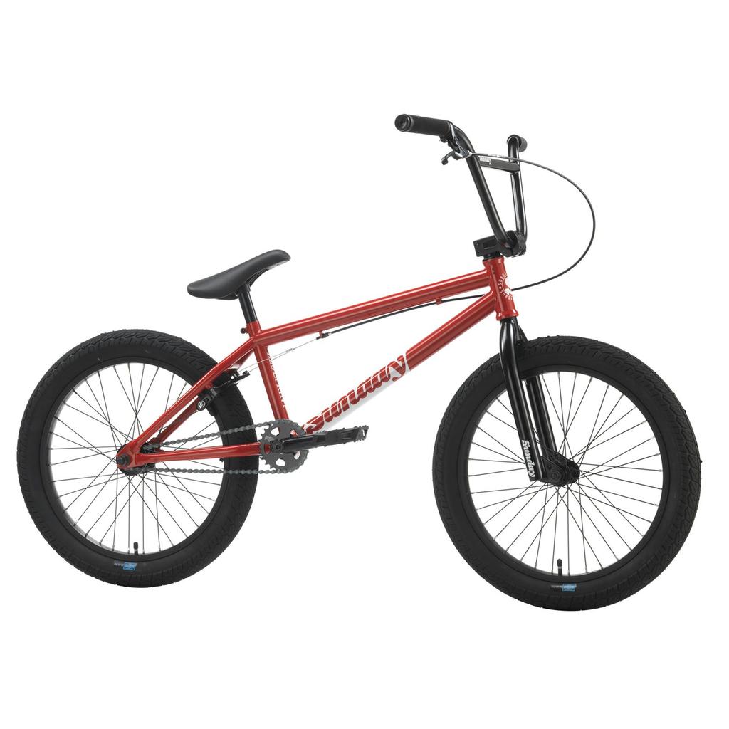 The Sunday Blueprint 20 inch Bike is shown in red with black handlebars, seat, and tires, side view on a white background. Ideal as a beginner BMX bike, it features reliable Odyssey Parts for smooth rides.