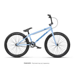 The Wethepeople Atlas 24 Inch Bike features a light blue frame with black handlebars, seat, pedals, and tires, plus "WETHEPEOPLE" branding—ideal as a pump track or racing cruiser—displayed against a white background.