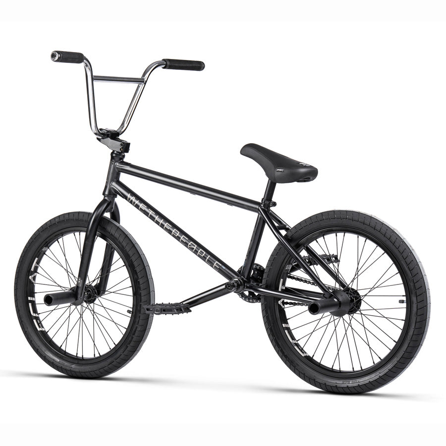 An ultimate performance black BMX bike featuring the Wethepeople Trust 20 Inch Cassette Bike and the Eclat Shift Freecoaster Hub with Hybrid Technology, all showcased against a crisp.