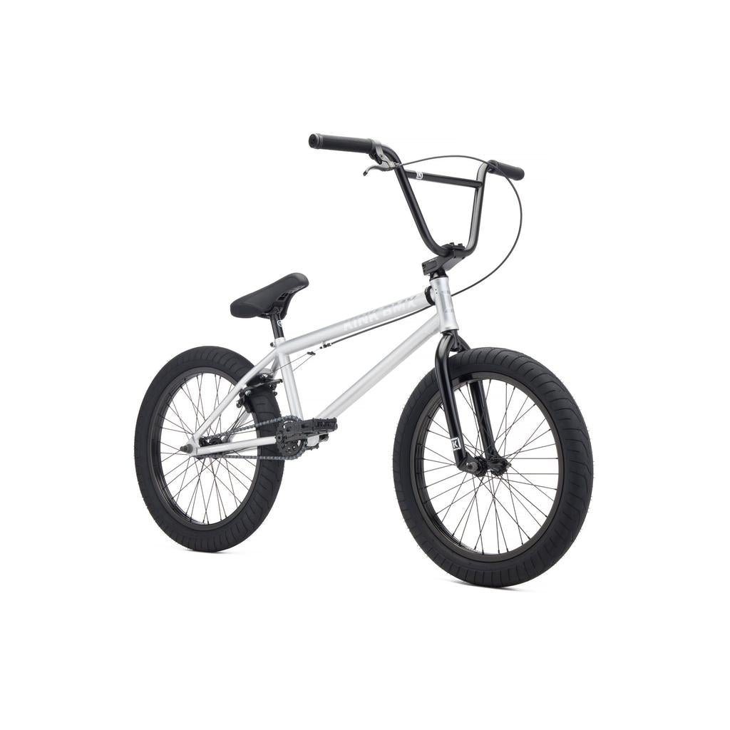 The Kink Whip 20 Inch Bike (2027) is a silver BMX bike with full Chromoly construction, black handlebars, seat, pedals, and tires, shown against a white background.