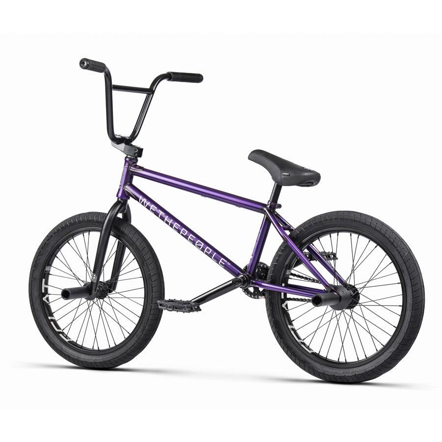 A purple Wethepeople Trust 20 Inch Cassette Bike on a white background.