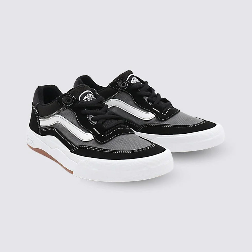 A pair of black and white low-top Vans Wayvee Pro Shoes with laces on a neutral background.