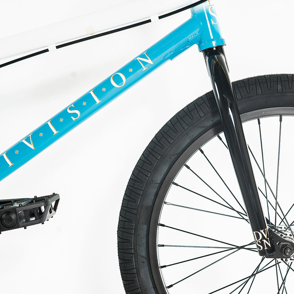 A blue Division Reark 20 Inch Bike with 3-piece cranks and a 20 inch frame, featuring the word "BMX" prominently displayed.
