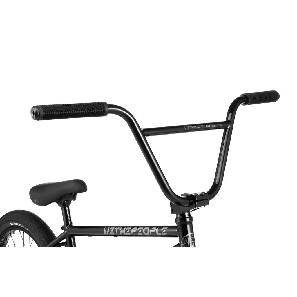 Close-up of a black Wethepeople Envy 20 Inch Bike, highlighting its handlebars, seat, and frame with "WETHEPEOPLE" in white letters and featuring high-quality Eclat components.