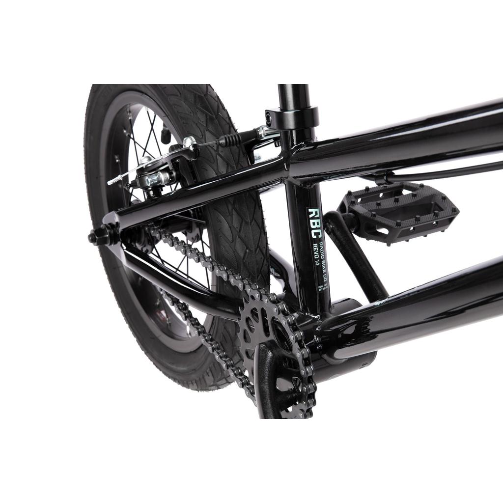 Close-up of the Radio Revo 14 Inch bike’s rear wheel, pedal, chain, and frame—showcasing detailed components ideal for anyone choosing their first bike.