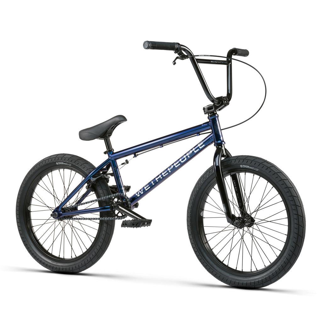 A blue Wethepeople CRS 20 Inch Bike on a white background, equipped with Salt Rookie Chromoly Three Piece Cranks and Eclat Surge Pedals.
