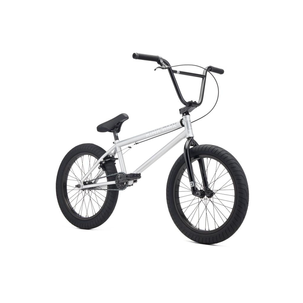 The Kink Whip 20 XL Inch Bike (2027) is a silver full Chromoly BMX with black handlebars, seat, pedals, and tires, shown on a white background—perfect for beginner riders.